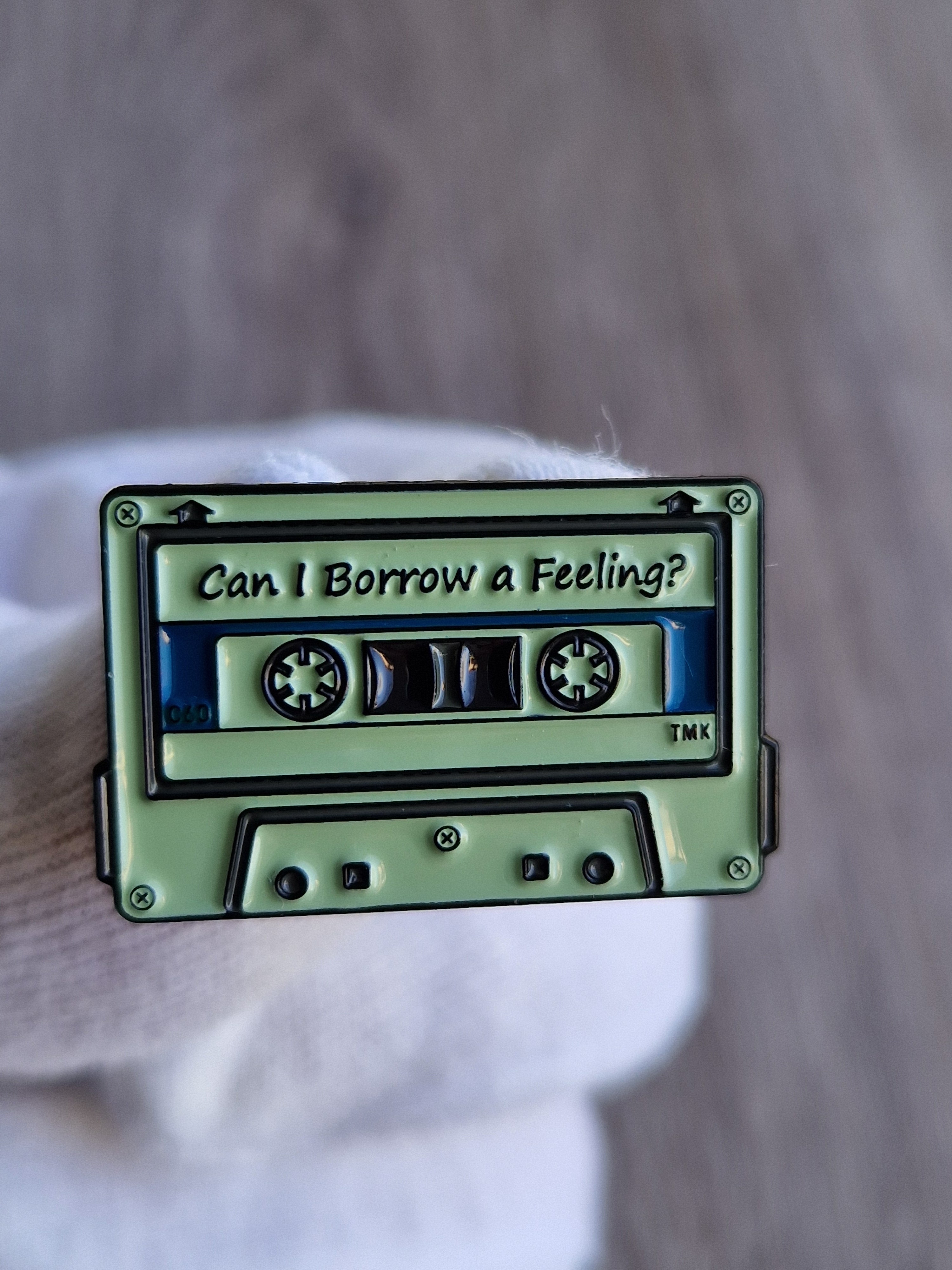 Spilla Audiocassetta “Can I Borrow a Feeling?”