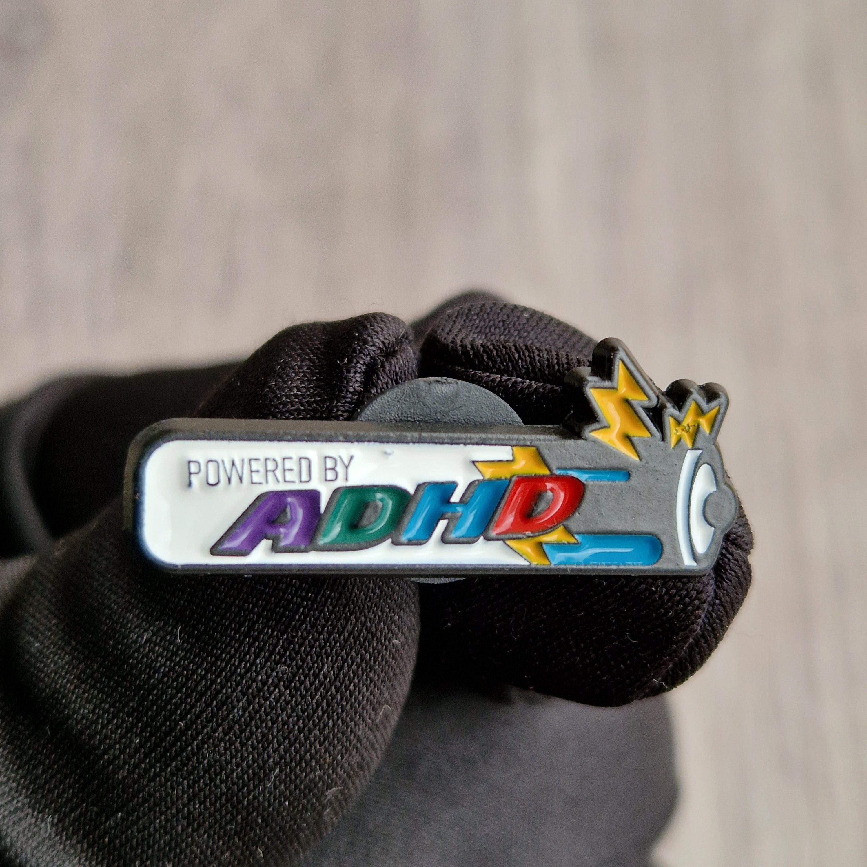 Spilla “Powered by ADHD”